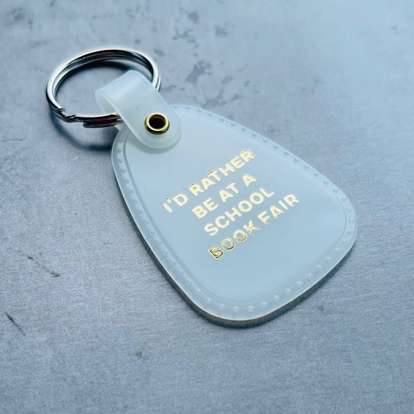 I’d Rather Be at a School Book Fair Saddle Keychain